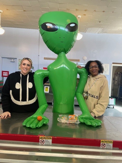 Email 5 - Alien in cafeteria.jpg